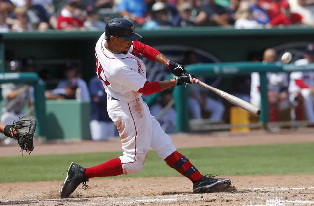 Boston Red Sox' Mookie Betts connects on a solo-home run in the seventh inning of a spring training baseball game against the Atlanta Braves Saturday, March 16, 2019, in Fort Myers, Fla. (Photo by John Bazemore/AP Photo)