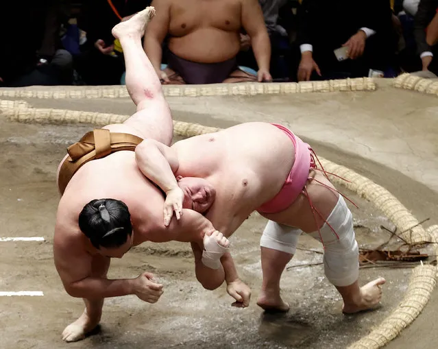 Komusubi Ura (R) throws Ryuden (L) to win on day fifteen of the Grand Sumo New Year Tournament at Ryogoku Kokugikan on January 28, 2024 in Tokyo, Japan. (Photo by The Asahi Shimbun via Getty Images)