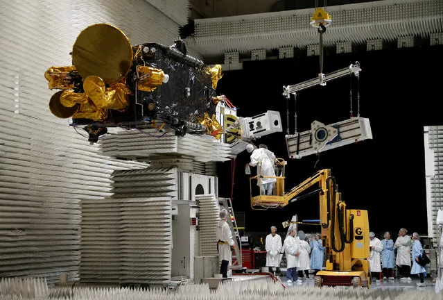 Technicians work on the Korean satellite Koreasat 5A in the clean room facilities of the Thales Alenia Space plant in Cannes, France, February 3, 2017. (Photo by Eric Gaillard/Reuters)