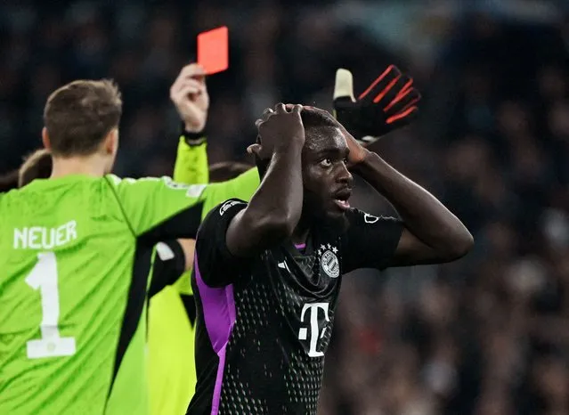 The referee Francois Letexier show a ref cardo to Dayot Upamecano of Bayern Munchen during the UEFA Champions League 2023/24 round of 16 first leg match between SS Lazio and FC Bayern München at Stadio Olimpico on February 14, 2024 in Rome, Italy. (Photo by Alberto Lingria/Reuters)