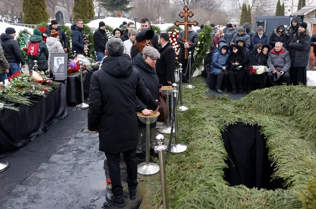 People attend the funeral of Russian opposition politician Alexei Navalny at the Borisovskoye cemetery in Moscow, Russia, on March 1, 2024. (Photo by Reuters/Stringer)
