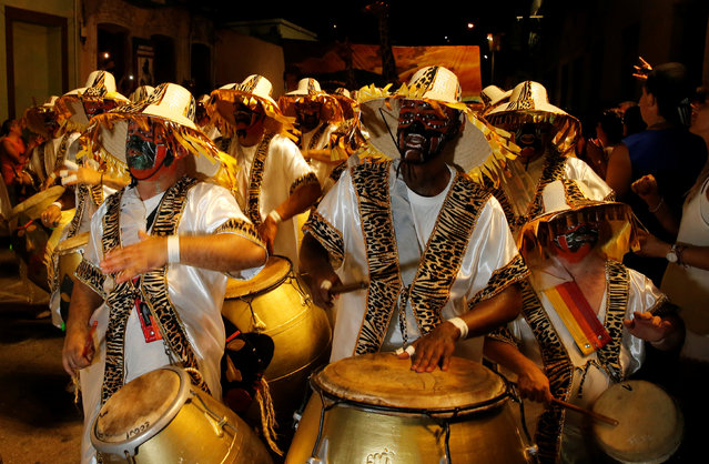 Members of a comparsa, a Uruguayan carnival group, play the drums during the Llamadas parade, a street fiesta with traditional Afro-Uruguayan roots in Montevideo February 9, 2017. (Photo by Andres Stapff/Reuters)