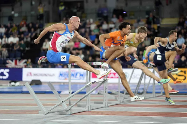 Petr Svoboda, of the Czech Republic, crashes into a hurdle while competing in a men's 60 meters hurdles heat during the World Athletics Indoor Championships at the Emirates Arena in Glasgow, Scotland, Saturday, March 2, 2024. (Phoot by Bernat Armangue/AP Photo)