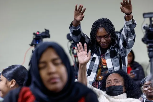People pray during a vigil for victims of the Francis Scott Key Bridge collapse at the Mount Olive Baptist Church on March 26, 2024 in Baltimore, Maryland. According to reports, rescuers are still searching for multiple people, while two survivors have been pulled from the Patapsco River. A work crew was fixing potholes on the bridge, which is used by roughly 30,000 people each day, when the cargo ship Dali struck at around 1:30am on Tuesday morning. The accident has temporarily closed the Port of Baltimore, one of the largest and busiest on the East Coast of the U.S. (Photo by Anna Moneymaker/Getty Images)