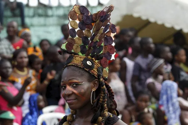 A woman with a painted face takes part in a parade during the Popo (Mask) Carnival of Bonoua, in the east of Abidjan, April 9, 2016. (Photo by Luc Gnago/Reuters)