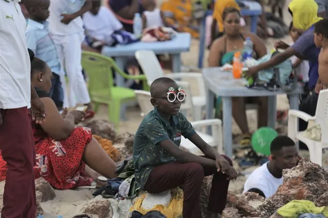 People enjoy their time on a beach during the Christmas holiday in Dar es Salaam, Tanzania, on December 25, 2021. (Photo by Xinhua News Agency/Rex Features/Shutterstock)