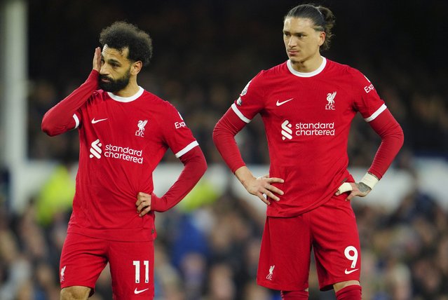 Liverpool's Mohamed Salah, left, and Liverpool's Darwin Nunez react during the English Premier League soccer match between Everton and Liverpool at the Goodison Park stadium in Liverpool, Britain, Wednesday, April 24, 2024. (Photo by Jon Super/AP Photo)