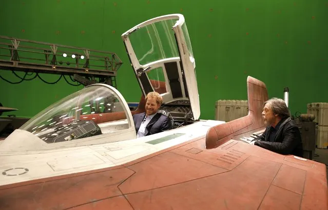 Britain's Prince Harry sits in an A-wing fighter as he talks with US actor Mark Hamill during a tour of the Star Wars sets at Pinewood studios in Iver Heath, west of London, Britain on April 19, 2016. (Photo by Adrian Dennis/Reuters)