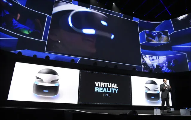 Andrew House, bottom right, president and global CEO of Sony Computer Entertainment Inc., talks about the Sony Morpheus virtual reality headset at the Sony Playstation at E3 2015 news conference at the Los Angeles Sports Arena on Monday, June 15, 2015, in Los Angeles. (Photo by Chris Pizzello/Invision/AP)