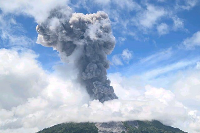 This handout photo taken and released by the Center for Volcanology and Geological Hazard Mitigation (PVMBG) on May 8, 2024 shows Mount Ibu spewing thick smoke in West Halmahera Regency in Indonesia's North Maluku Province. (Photo by Handout / Center for Volcanology and Geological Hazard Mitigation (PVMBG)/AFP Photo)