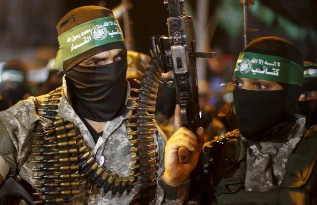 Palestinians Hamas militants march during an anti-Israel rally in Gaza City July 8, 2015. July 8th marks the one-year anniversary of the war between Israel and Hamas in Gaza. The 50-day conflict began after Israel said it was determined to put an end to constant rocket-fire from Gaza, launching an intense air and ground assault to do so. It was the third major conflict between Israel and Hamas militants since the Islamist group seized control of Gaza in 2007. (Photo by Suhaib Salem/Reuters)