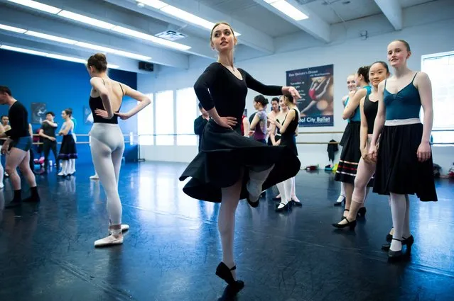 Ballerina Lucila Munaretto, from Argentina,, center, rehearses in Vancouver on Thursday, May 19, 2016. Nine months after suffering brain and spine injuries, Munaretto is about to resume her ballet career. The young dancer will perform for about 45 minutes in a production of Swan Lake on Saturday in Vancouver. (Photo by Darryl Dyck/The Canadian Press via AP Photo)