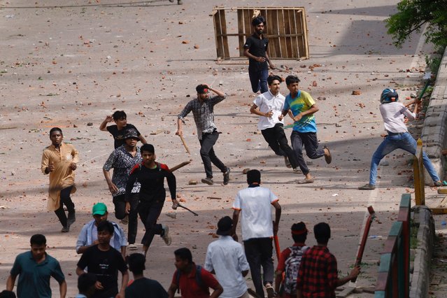 Bangladesh Chhatra League, the student wing of the ruling party Bangladesh Awami League, and anti-quota protesters engage in a clash at the Dhaka College area, in Dhaka, Bangladesh on July 16, 2024. (Photo by Mohammad Ponir Hossain/Reuters)