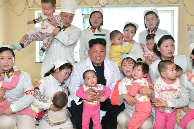 North Korean leader Kim Jong Un smiles during a visit to Taesongsan General Hospital in this undated photo released by North Korea's Korean Central News Agency (KCNA) in Pyongyang May 19, 2014. (Photo by Reuters/KCNA)