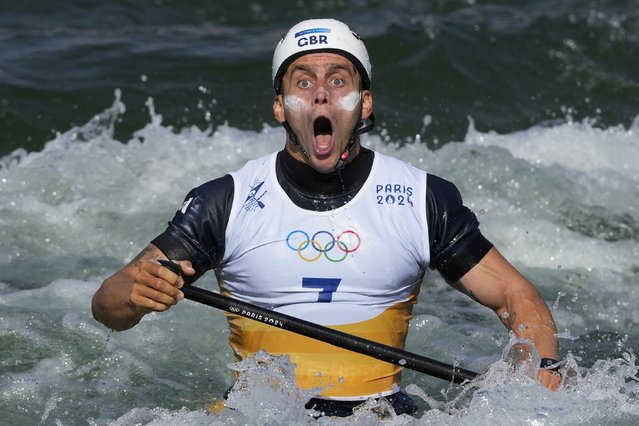 Adam Burgess of Britain reacts at the finish line of the men's canoe single finals during the canoe slalom at the 2024 Summer Olympics, Monday, July 29, 2024, in Vaires-sur-Marne, France. (Photo by Kirsty Wigglesworth/AP Photo)