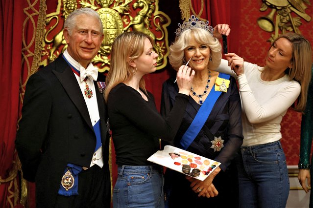 Studio assistants retouch a new waxwork representation of Britain's Queen Consort Camilla as it stands next to a waxwork representation of Britain’s King Charles as part of the new attraction “The Royal Palace” experience, ahead of The Coronation celebrations, at Madame Tussauds in London, Britain on April 26, 2023. (Photo by Hannah McKay/Reuters)