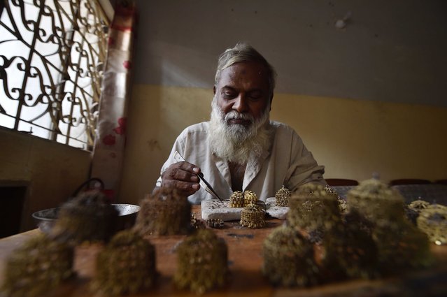 A goldsmith crafts gold jewelry at a workshop in Karachi, Pakistan, 01 September 2024. Gold prices in Pakistan saw an increase on 31 August, with the price per tola rising by Rs1,000 (approximately 3.65USD) to reach Rs262,500 (about 958.43USD), despite a decline in international gold rates. The price for 10 grams of gold also increased by Rs857 (approximately 3.13USD), settling at Rs225,051 (about 822.97USD). Last week, gold prices in Pakistan reached a record high of Rs263,700 (about 961.16USD) per tola, reflecting the ongoing volatility and demand in the precious metals market. (Photo by Shahzaib Akber/EPA/EFE)