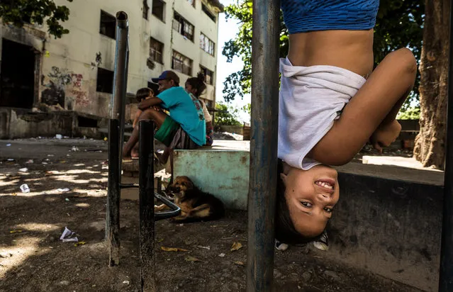A resident plays outside. (Photo by Tariq Zaidi/The Guardian)