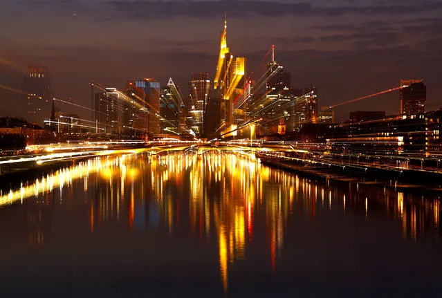 The Frankfurt skyline with its financial district is photographed on early evening in Frankfurt, Germany, March 25, 2018. Picture is taken with long time exposure while using the zoom. (Photo by Kai Pfaffenbach/Reuters)