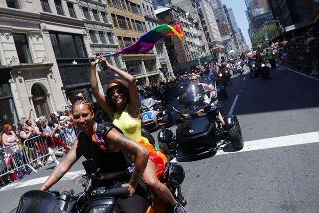 People take part in the 2022 NYC Pride parade in Manhattan, New York City, New York , U.S., June 26, 2022. (Photo by Jeenah Moon/Reuters)