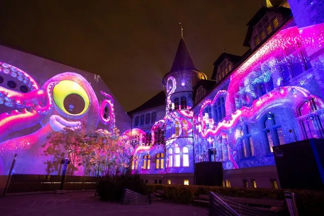 The Swiss national museum is illuminated by the “Yuki Show – Arctic Christmas” (Arktische Weihnacht) lightshow by artists of Projektil group during a media preview at the Illuminarium festival in Zurich, Switzerland November 9, 2021. (Photo by Arnd Wiegmann/Reuters)