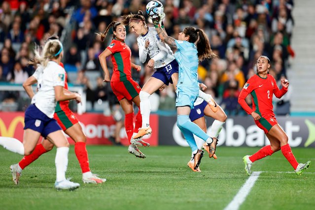 Alex Morgan #13 of the United States collides with Inês Pereira #1 of Portugal as they go for the ball during the first half of the FIFA Women's World Cup Australia & New Zealand 2023 Group E match between Portugal and USA at Eden Park on August 01, 2023 in Auckland, New Zealand. (Photo by Carmen Mandato/USSF/Getty Images)