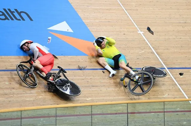 Matthew Glaetzer of Team Australia and Joe Truman of Team England crash during the Men's Track Cycling Keirin Second Round Heat One on day two of the Birmingham 2022 Commonwealth Games at Lee Valley Velopark Velodrome on July 30, 2022 on the London, England. (Photo by Justin Setterfield/Getty Images)