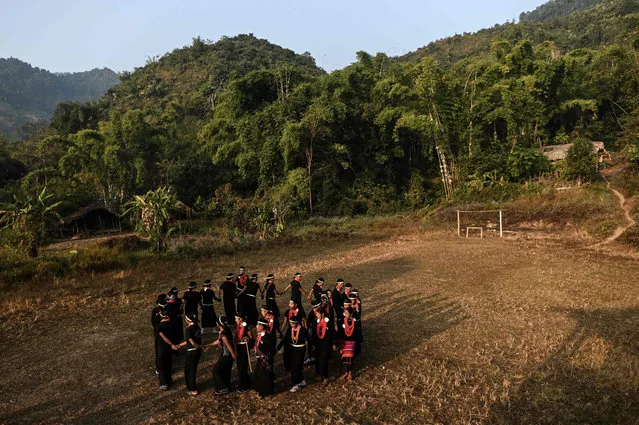 This photo taken on February 7, 2020 shows the end of an overnight ceremony to bless the harvest by Naga tribeswomen in Satpalaw Shaung village, Lahe township in Myanmar's Sagaing region. (Photo by Ye Aung Thu/AFP Photo)