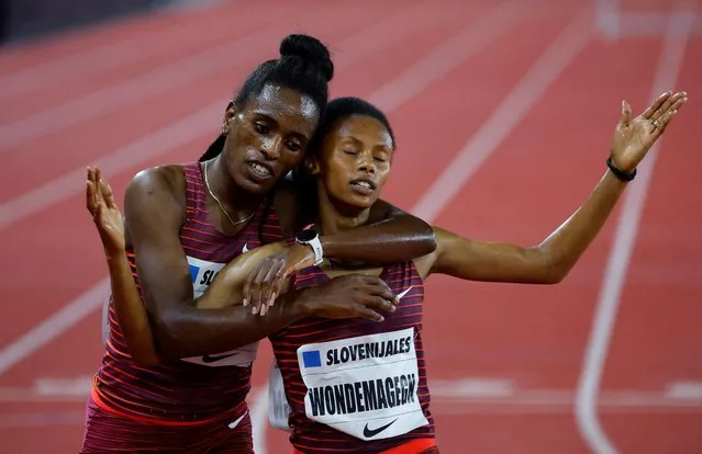 Ethiopia's Werkuha Getachew celebrates with compatriot Zerfe Wondemagegn after winning the 3000m Stepplechase Women event at the Wanda Diamond League athletics meeting at the Louis II Stadium in Monaco on August 10, 2022. (Photo by Eric Gaillard/Reuters)