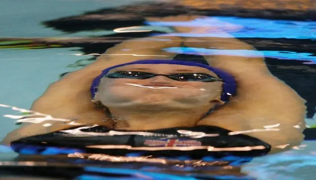 Britain's Georgia Davies starts a women's 50m backstroke first round heat at the LEN Swimming European Championships in Berlin, Germany, Friday, August 22, 2014. (Photo by Gero Breloer/AP Photo)
