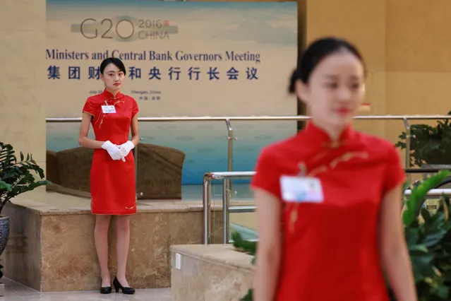Hostesses stand on duty at the venue for the G20 Finance Ministers and Central Bank Governors Meeting to be held over the weekend in Chengdu in Southwestern China's Sichuan province, Saturday, July 23, 2016. (Photo by Ng Han Guan/Reuters)