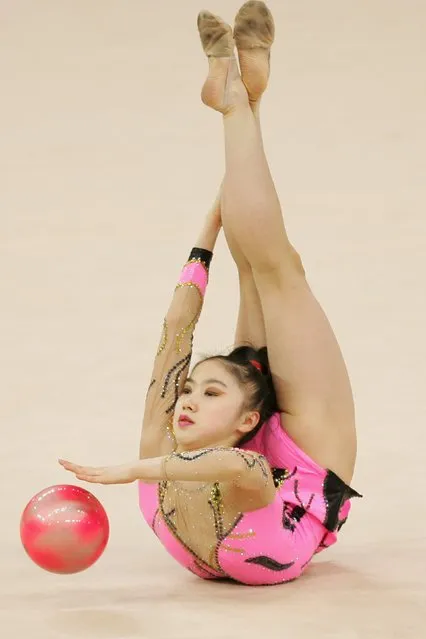 Xiao Yiming of China competes in the Rhythmic Gymnastics Individual All-Around Final during the 15th Asian Games Doha 2006 at Aspire Hall on December 10, 2006 in Doha, Qatar. (Photo by Julian Finney/Getty Images for DAGOC)