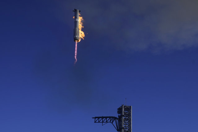 SpaceX's mega rocket Starship booster returns to the launch pad during a test flight from Starbase in Boca Chica, Texas, Thursday, January 16, 2025. (Photo by Eric Gay/AP Photo)
