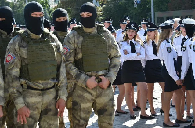 Police officers attend an official ceremony in the center of Kiev on August 4, 2016, to celebrate the first Ukrainian national police day. (Photo by Sergei Supinsky/AFP Photo)