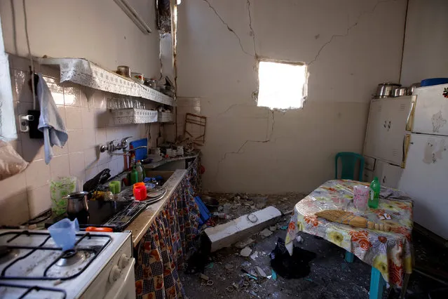 The damaged interior of a home is pictured after an explosion took place late Monday in the Kafr Sousa area in Damascus, Syria July 26, 2016. (Photo by Omar Sanadiki/Reuters)