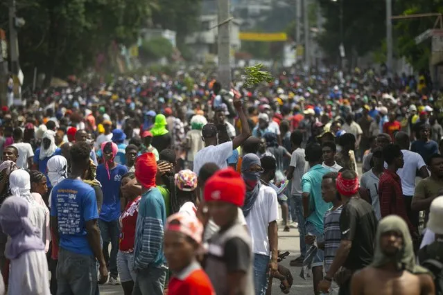 Demonstrators fill the streets during a protest to demand the resignation of Prime Minister Ariel Henry, in the Petion-Ville area of Port-au-Prince, Haiti, Monday, October 3, 2022. (Photo by Joseph Odelyn/AP Photo)