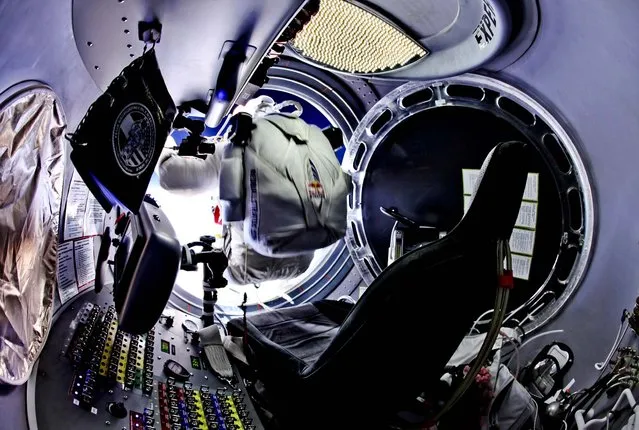 24 miles up, Baumgartner prepares to jump from the capsule. (Photo by Jay Nemeth/Red Bull Stratos)