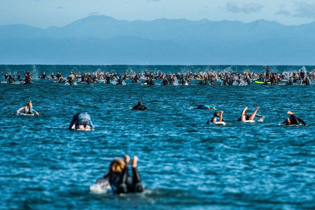Demonstrators participate in a “paddle out” in the memory of George Floyd at Cowell Beach in Santa Cruz, California on June 7, 2020 after the death of George Floyd. (Photo by Chris Tuite/ImageSPACE/Rex Features/Shutterstock)