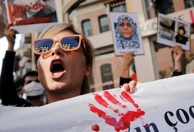 A member of the Iranian community living in Turkey attends a protest in support of Iranian women and against the death of Mahsa Amini, near the Iranian consulate in Istanbul, Turkey on October 24, 2022. (Photo by Dilara Senkaya/Reuters)