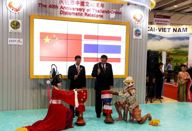 China's Vice Premier Zhang Gaoli (L) and Thailand's Deputy Prime Minister and Foreign Minister General Tanasak Patimapragorn attend the opening ceremony of the Thai exhibition hall during the China-ASEAN Expo in Nanning, Guangxi Zhuang Autonomous Region, China, September 18, 2015. (Photo by Reuters/China Daily)
