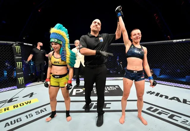 In this handout image provided by UFC, Rose Namajunas celebrates after her split-decision victory over Jessica Andrade of Brazil in their strawweight fight during the UFC 251 event at Flash Forum on UFC Fight Island on July 12, 2020 on Yas Island, Abu Dhabi, United Arab Emirates. (Photo by Jeff Bottari/Zuffa LLC via Getty Images)