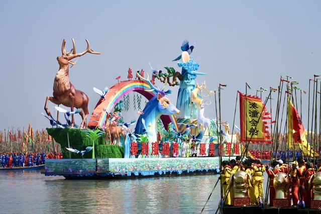 Boats in brilliant colors and varied shapes dash out like arrows on Qinhu Lake during the annual Qintong Boat Festival on April 6, 2025 in Taizhou, Jiangsu Province of China. The 2025 Taizhou Jiangyan Qintong Boat Festival is held on April 6 at Qinhu Lake, showcasing a spectacular array of boats in a centuries-old tradition. (Photo by VCG/VCG via Getty Images)