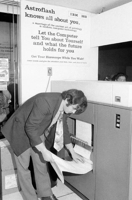 At the “Astroflash” office in Grand Central Terminal in New York January 18, 1971. Your horoscope is computed by IBM machines after you give your day, month, and year of birth, plus city and state, and, if possible, the exact hour. IBM card in punched with this data, and then run through the computer, which spills out your character portrait and a six-month forecast on many sheets of computer copy, costs $10.00. There are other, mote economical readings to be had. The computer operator is Joseph Chillo; the receptionist is Maryliz (cq) Scott. The girl reacting to her horoscope is Elizabeth Speert. (Photo by John Lent/AP Photo)