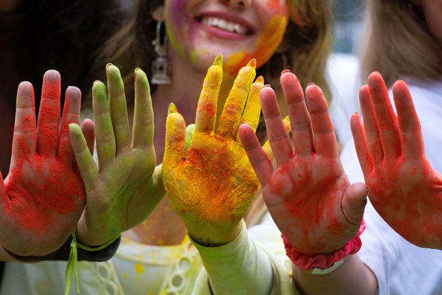 The Indian community and supporters living in Brazil celebrate the festival of colors in Sao Paulo, Brazil on March 24, 2024. A Burst of Colors and Tradition Holi, characterized by vivid hues, gulaal, and rituals, transcends mere festivity; it's a grand jubilation of joy and camaraderie. Legend has it that the festival commemorates the triumph of Lord Narasimha over the demon Hiranyakashyap, representing the victory of righteousness over malevolence. (Photo by Dario Oliveira/ZUMA Press Wire/Rex Features/Shutterstock)