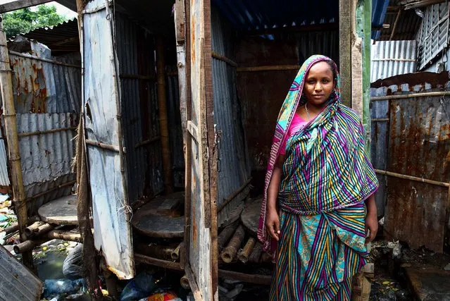 Bangladesh. Rubina, 38, has lived in Mollar Bosti slum in Dhaka for 3 years. She moved from the countryside when her husband got a job in Dhaka. The toilet she uses is known as a shared hanging toilet and is situated 20 metres from her house. She says that once, in middle of the night, she went to the toilet and someone knocked the toilet door so hard she thought they were going to break the door down. She got very scared and since then, she has been too scared to use the toilet after 9pm. (Photo by GMB Akash/WSUP/Panos)
