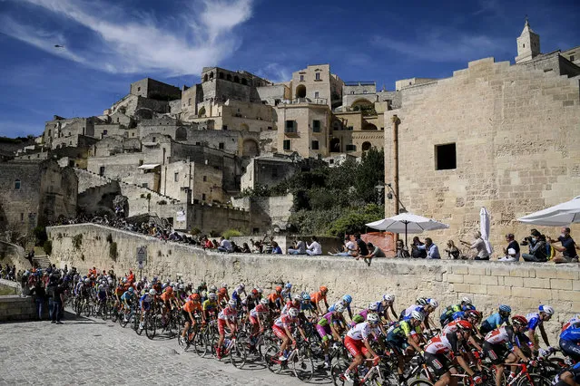 The pack of cyclists pedals past Matera at the start of the seventh stage of the Giro d'Italia cycling race, from Matera to Brindisi, southern Italy, Friday, October 9, 2020. (Photo by Fabio Ferrari/LaPresse via AP Photo)