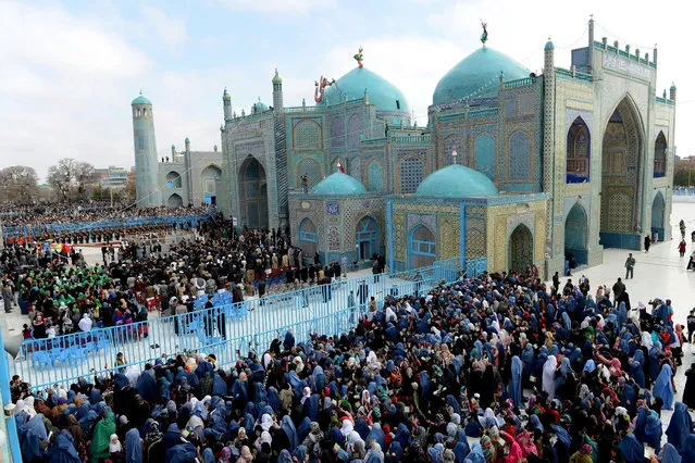 Afghan revellers gather for Nowruz festivities in Mazar-i Sharif, the centre of the Afghan new year celebrations, on March 21, 2013. (Photo by Shah Marai/AFP Photo)