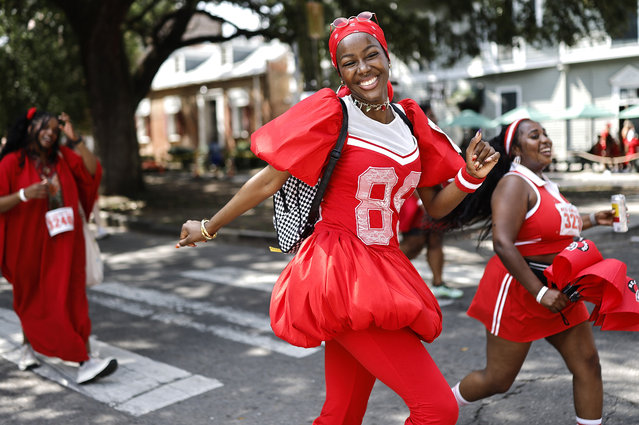 People participate in the Red Dress Run, an annual charity event where runners, walkers, and drinkers make their way along a two-mile course passing through the French Quarter and surrounding areas on August 9, 2025 in New Orleans, Louisiana. New Orleans and the Gulf Coast region are preparing to mark the 20 year anniversary of Hurricane Katrina, which occurred on August 29, 2005. The failure of levees during the catastrophic storm in New Orleans flooded about 80 percent of the city including historic communities such as the Lower Ninth Ward. Katrina resulted in nearly 1,400 deaths, according to revised statistics from the National Hurricane Center, and remains the costliest storm in U.S. history at around $200 billion in today's dollars. (Photo by Mario Tama/Getty Images)