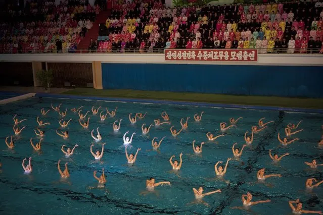 North Korean synchronized swimmers perform at a mass synchronized swimming exhibition event in Pyongyang on Friday, February 15, 2013. (Photo by David Guttenfelder/AP Photo)