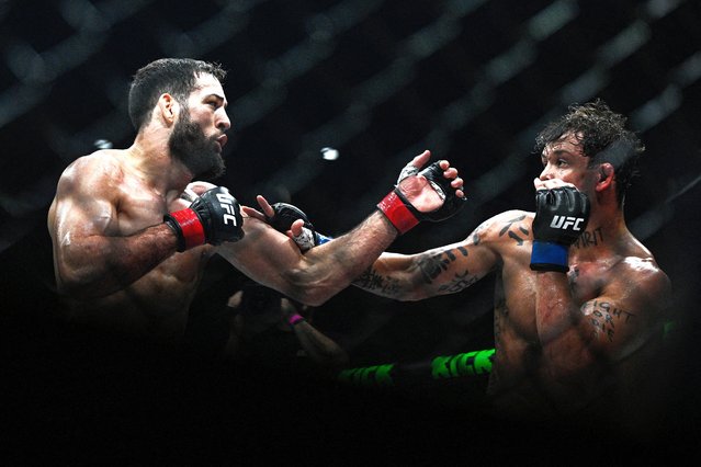 France's Nassourdine Imavov (L) fights against Brazil's Caio Borralho during their mixed martial arts at the 4th edition of the Ultimate Fighting Championship (UFC) average weights at the Bercy Accor Arena, in Paris, on September 6, 2025. (Photo by Julien de Rosa/AFP Photo)
